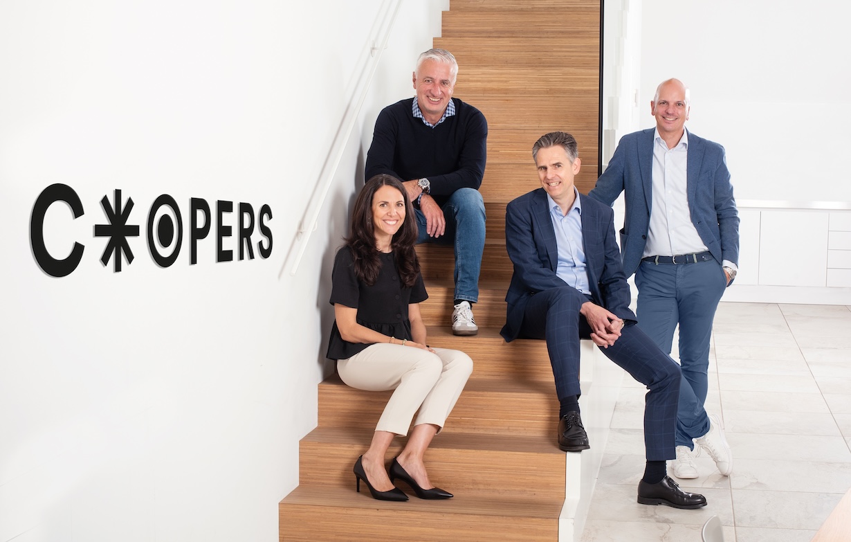 A group photo of Cooper's Board of Directors featuring Denise Stuker, Olivier Rihs, Michael Wiendl, and Christian Biedermann (from left to right)